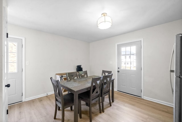 dining room with light wood-type flooring