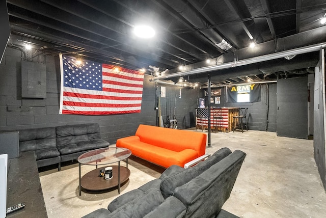 basement with bar area and electric panel