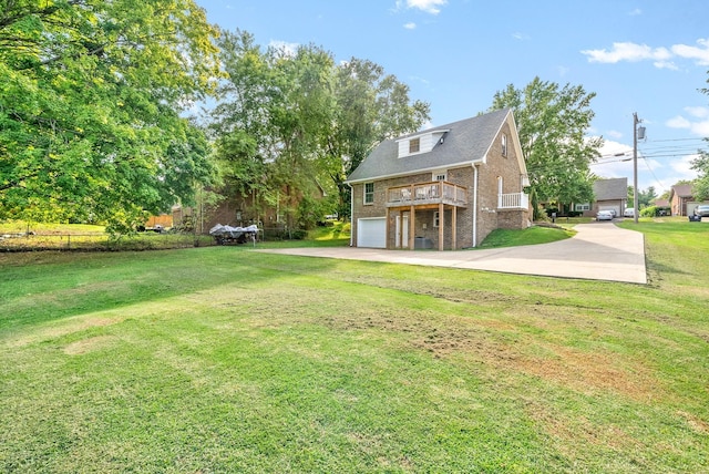 view of yard featuring a wooden deck and a garage