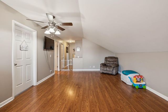 additional living space with dark wood-type flooring, ceiling fan, and lofted ceiling