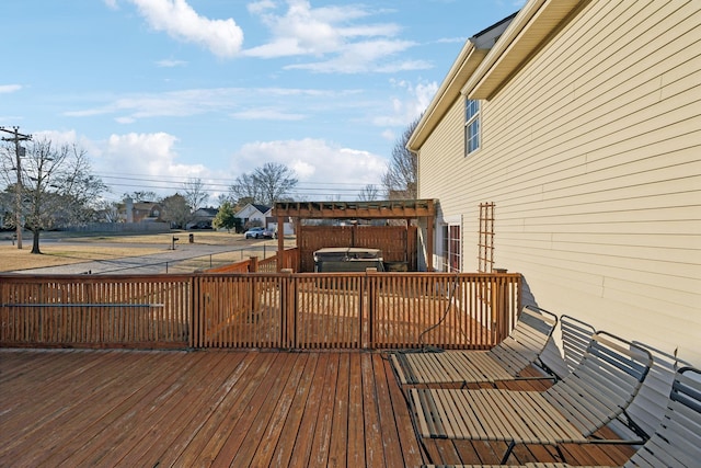 wooden deck featuring a jacuzzi