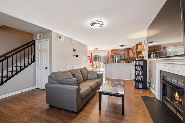 living room featuring hardwood / wood-style flooring and a wealth of natural light