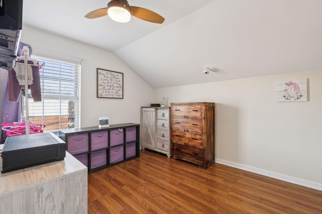 bedroom featuring lofted ceiling, dark hardwood / wood-style floors, and ceiling fan