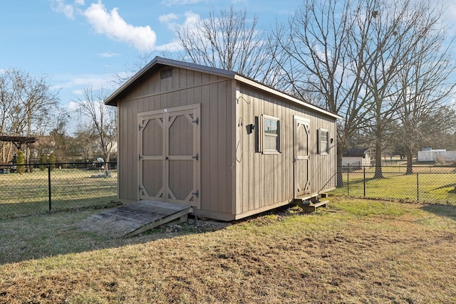 view of outdoor structure with a lawn