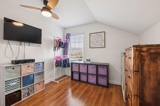 interior space with hardwood / wood-style flooring, ceiling fan, and lofted ceiling