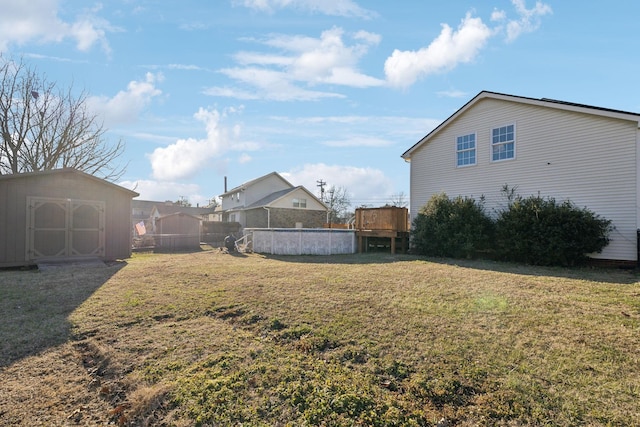 view of yard with a storage unit