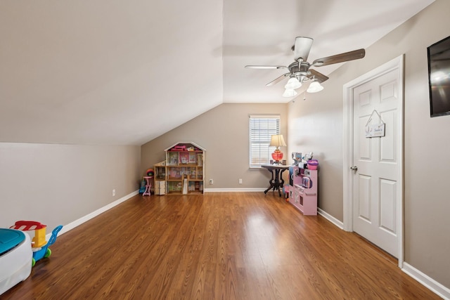 game room featuring hardwood / wood-style flooring, ceiling fan, and vaulted ceiling