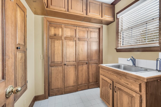 kitchen featuring sink and tile countertops