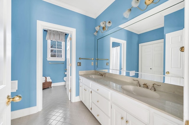 bathroom featuring tile patterned flooring, vanity, crown molding, and toilet