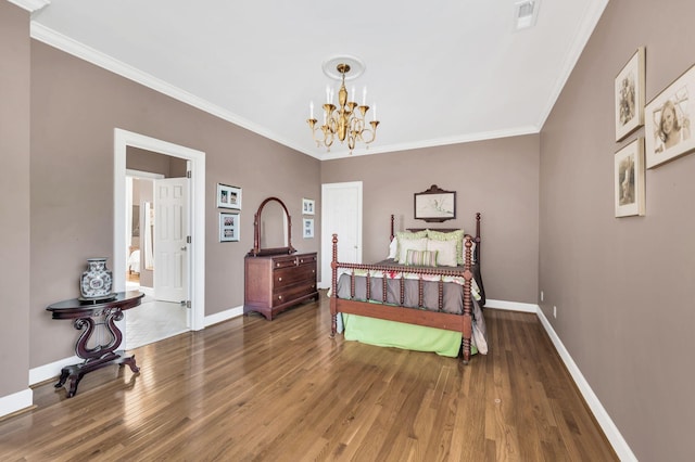 bedroom with crown molding, dark hardwood / wood-style flooring, and an inviting chandelier