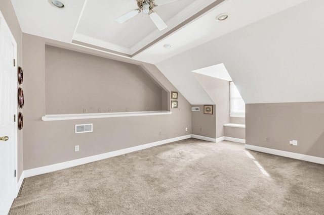 bonus room with carpet floors and ceiling fan