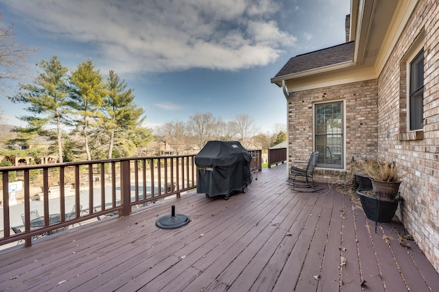 wooden terrace with grilling area