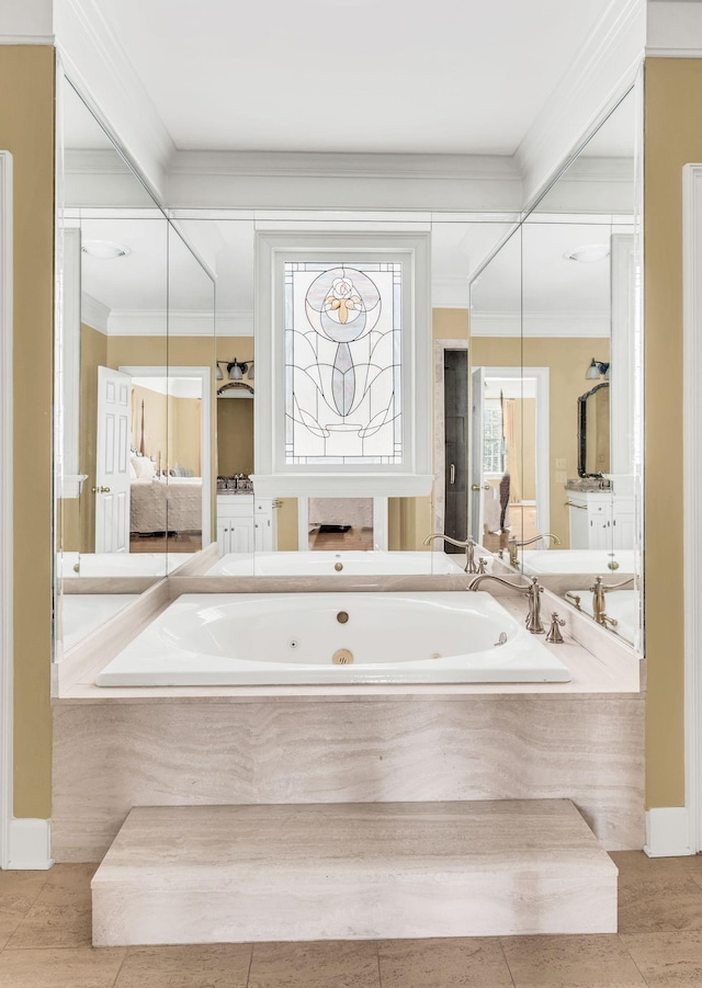 bathroom featuring a relaxing tiled tub, a wealth of natural light, and tile patterned floors