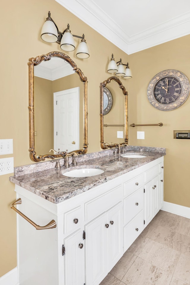 bathroom with crown molding and vanity