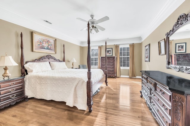 bedroom with crown molding, ceiling fan, and light wood-type flooring