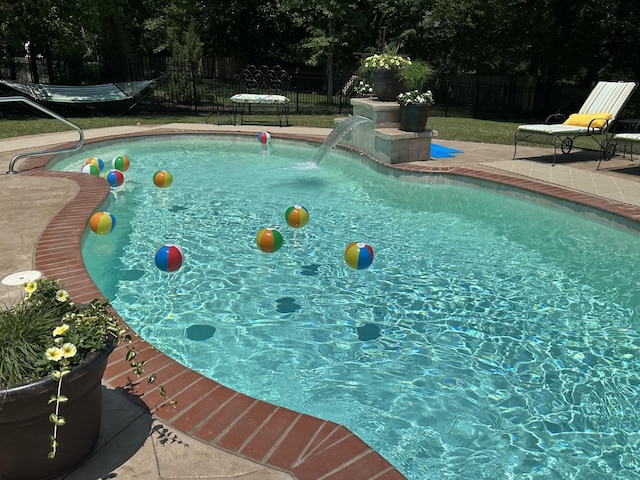 view of pool featuring a patio and pool water feature