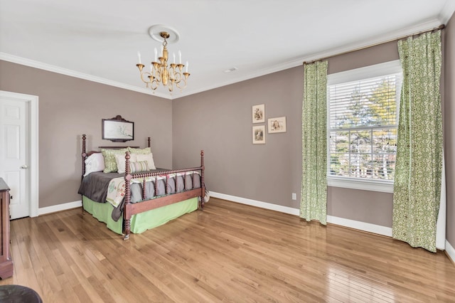 bedroom featuring hardwood / wood-style flooring, ornamental molding, multiple windows, and a notable chandelier