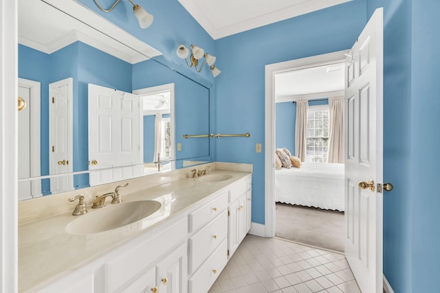 bathroom with ornamental molding, tile patterned floors, and vanity