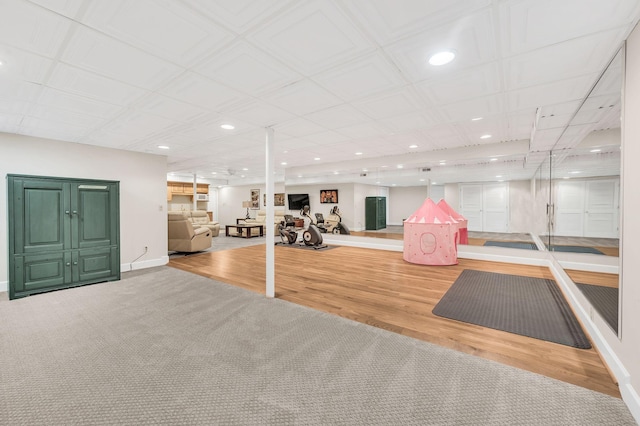 exercise area with light wood-type flooring