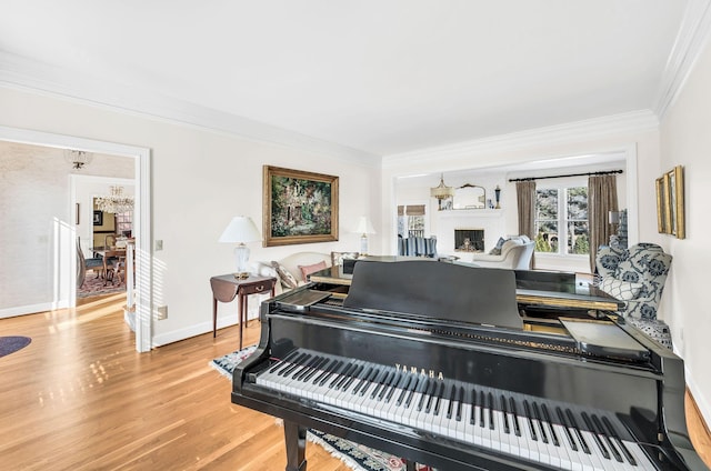 misc room with hardwood / wood-style flooring and ornamental molding