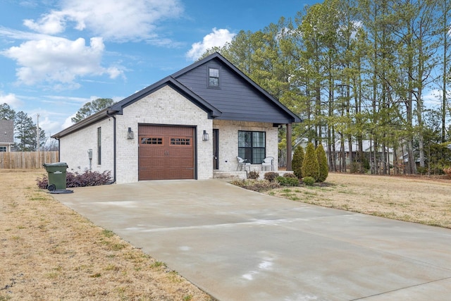 view of front facade with a garage and a front yard