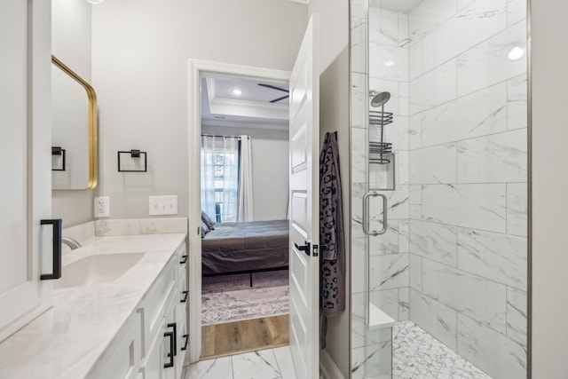 bathroom featuring vanity, ornamental molding, and walk in shower