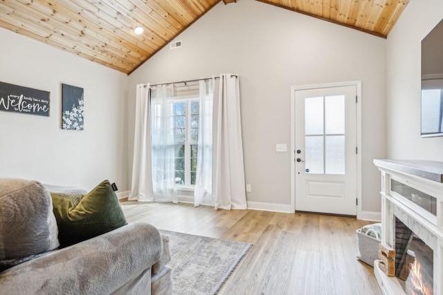 living room featuring high vaulted ceiling, wood ceiling, light hardwood / wood-style floors, and beamed ceiling