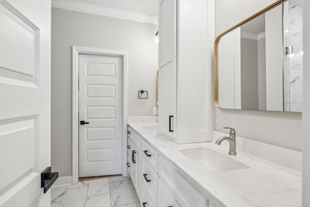 bathroom with ornamental molding and vanity