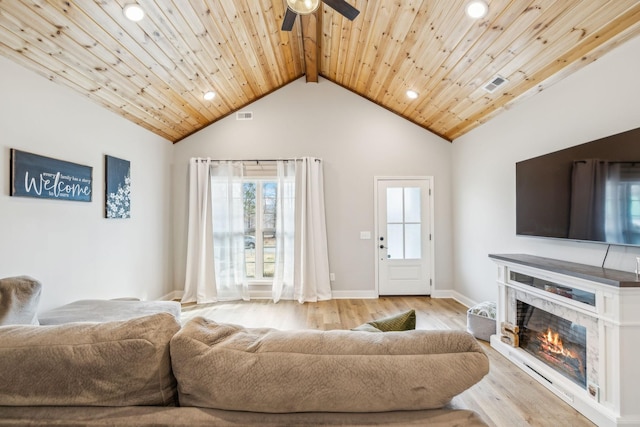 living room with beam ceiling, ceiling fan, light wood-type flooring, and wood ceiling