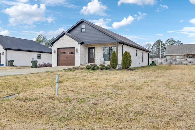 view of front of home with a garage and a front yard