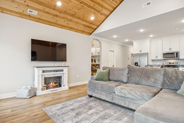 living room with light hardwood / wood-style flooring, a fireplace, ornamental molding, vaulted ceiling, and wooden ceiling