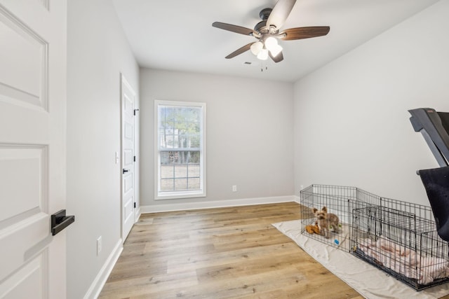 interior space with light hardwood / wood-style flooring and ceiling fan