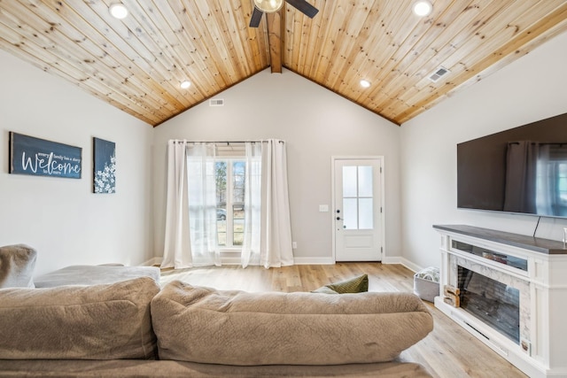 living room featuring beamed ceiling, ceiling fan, light wood-type flooring, and wooden ceiling