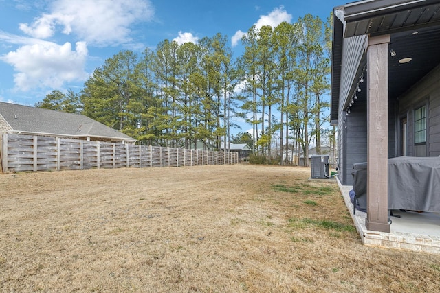 view of yard with central air condition unit