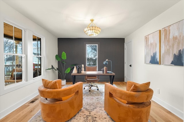 office space with light wood-type flooring