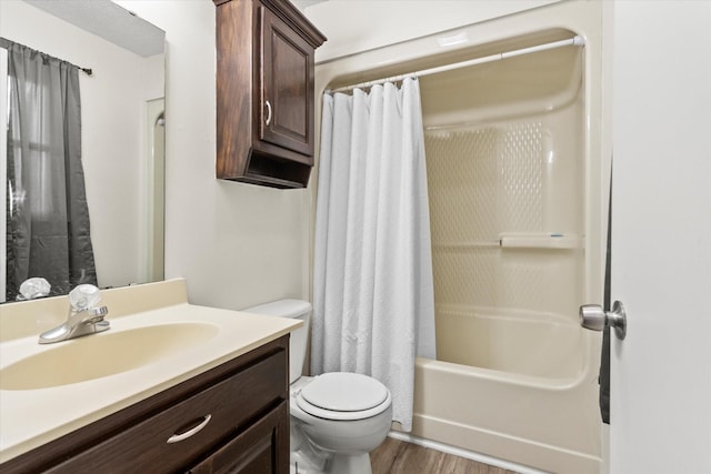 full bathroom with vanity, hardwood / wood-style floors, shower / bath combination with curtain, and toilet