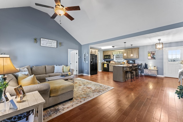 living room with sink, dark wood-type flooring, high vaulted ceiling, and ceiling fan