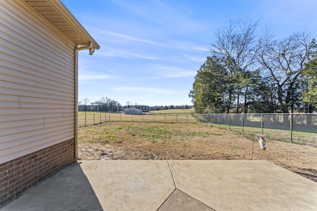 view of yard with a patio and a rural view