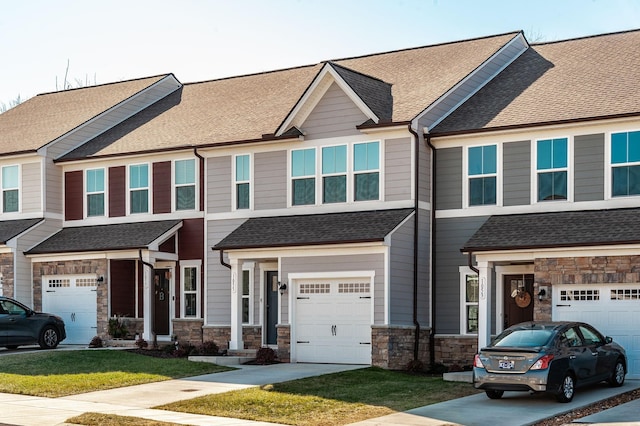 view of front facade featuring a garage and a front lawn