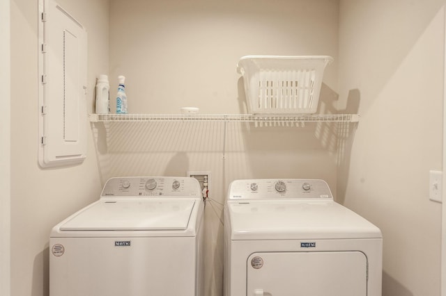 clothes washing area with independent washer and dryer