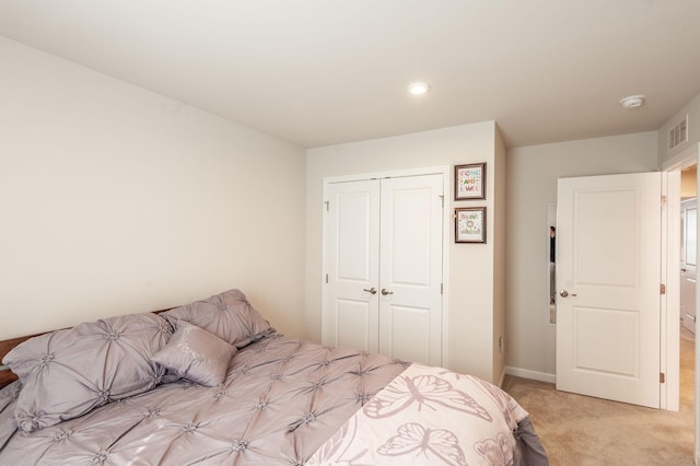 carpeted bedroom with a closet