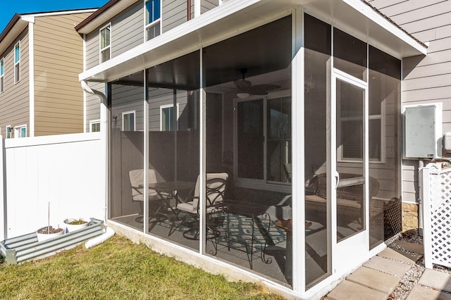 view of side of home featuring a sunroom