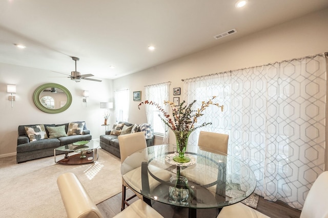 dining area featuring ceiling fan and carpet flooring