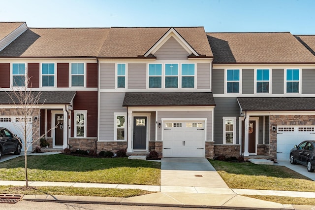 view of front facade featuring a garage and a front lawn