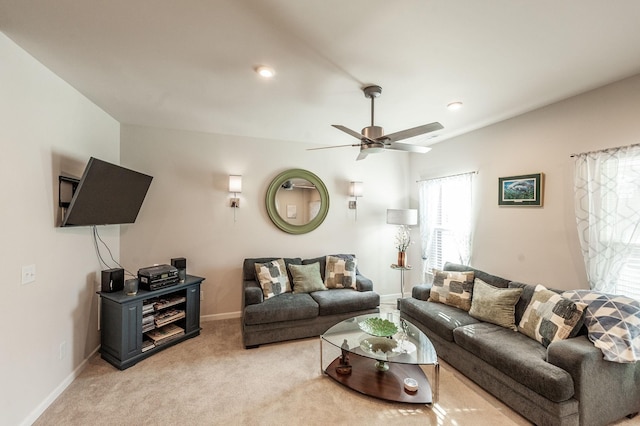 living room featuring light carpet and ceiling fan