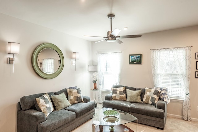 carpeted living room featuring ceiling fan