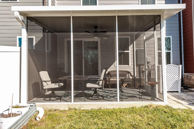 view of patio featuring a sunroom