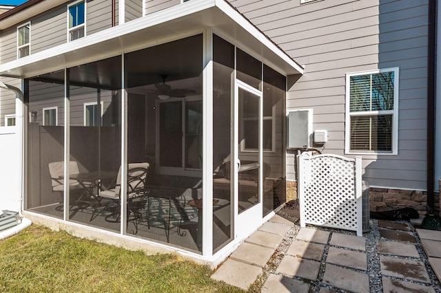 view of patio with a sunroom