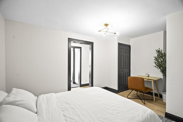 bedroom featuring a closet and light hardwood / wood-style flooring