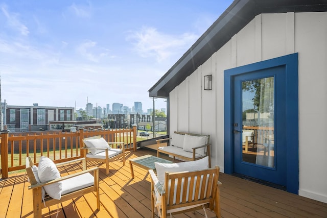 wooden terrace with outdoor lounge area